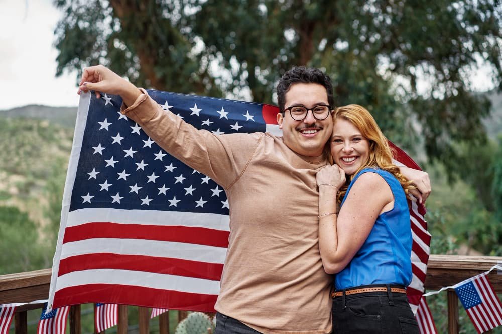 medium-shot-smiley-couple-with-usa-flag.jpg